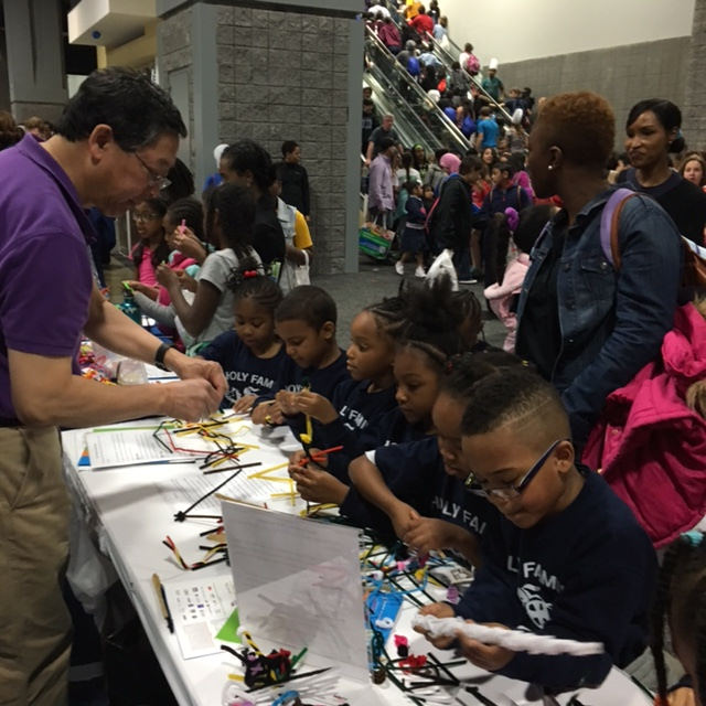 BPS Council member Bob Nakamoto, University of Virginia, helps elementary school students with their neuron models.