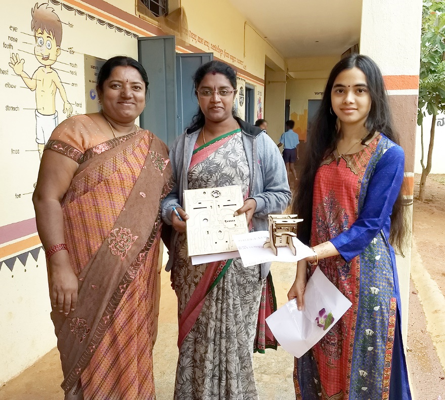 Umika (right) with government teachers in Bangalore, India at a BPS-sponsored light microscopy outreach session in Summer 2018.