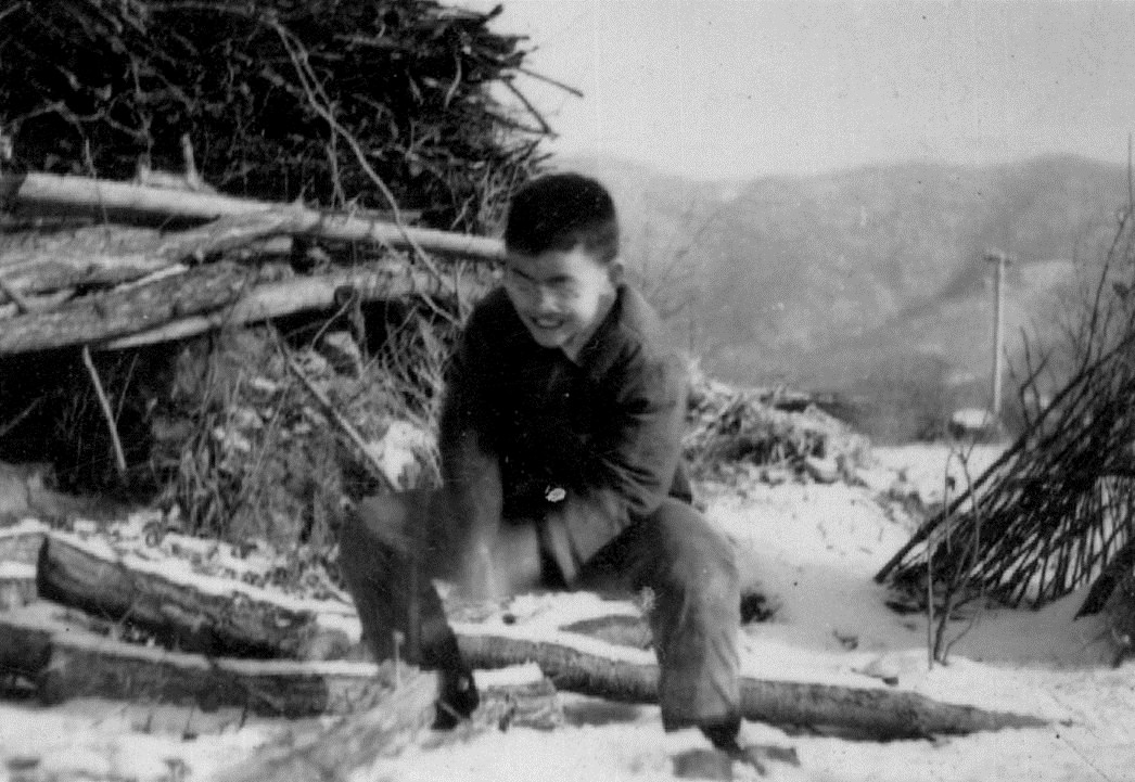 Wang chopping wood at age 11 or 12. 