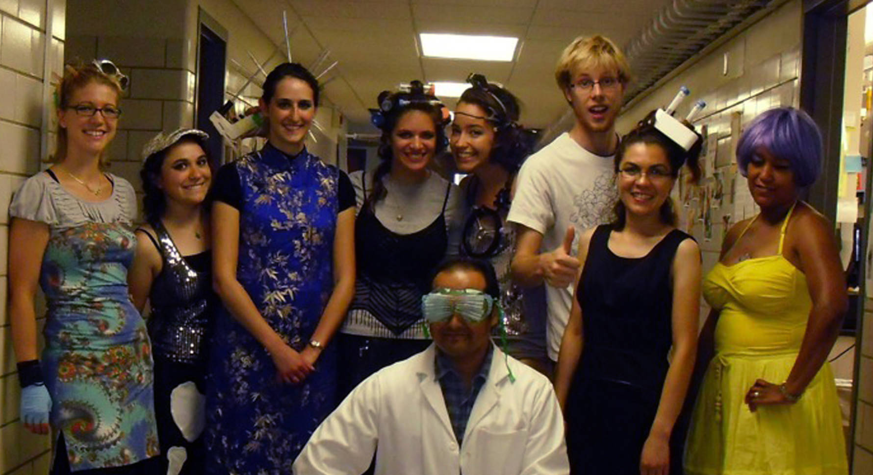 Ross and students pose after filming a fun lab video, a spoof of the song “Telephone” by Lady Gaga and Beyonce. Their version is titled “Microscope.” 