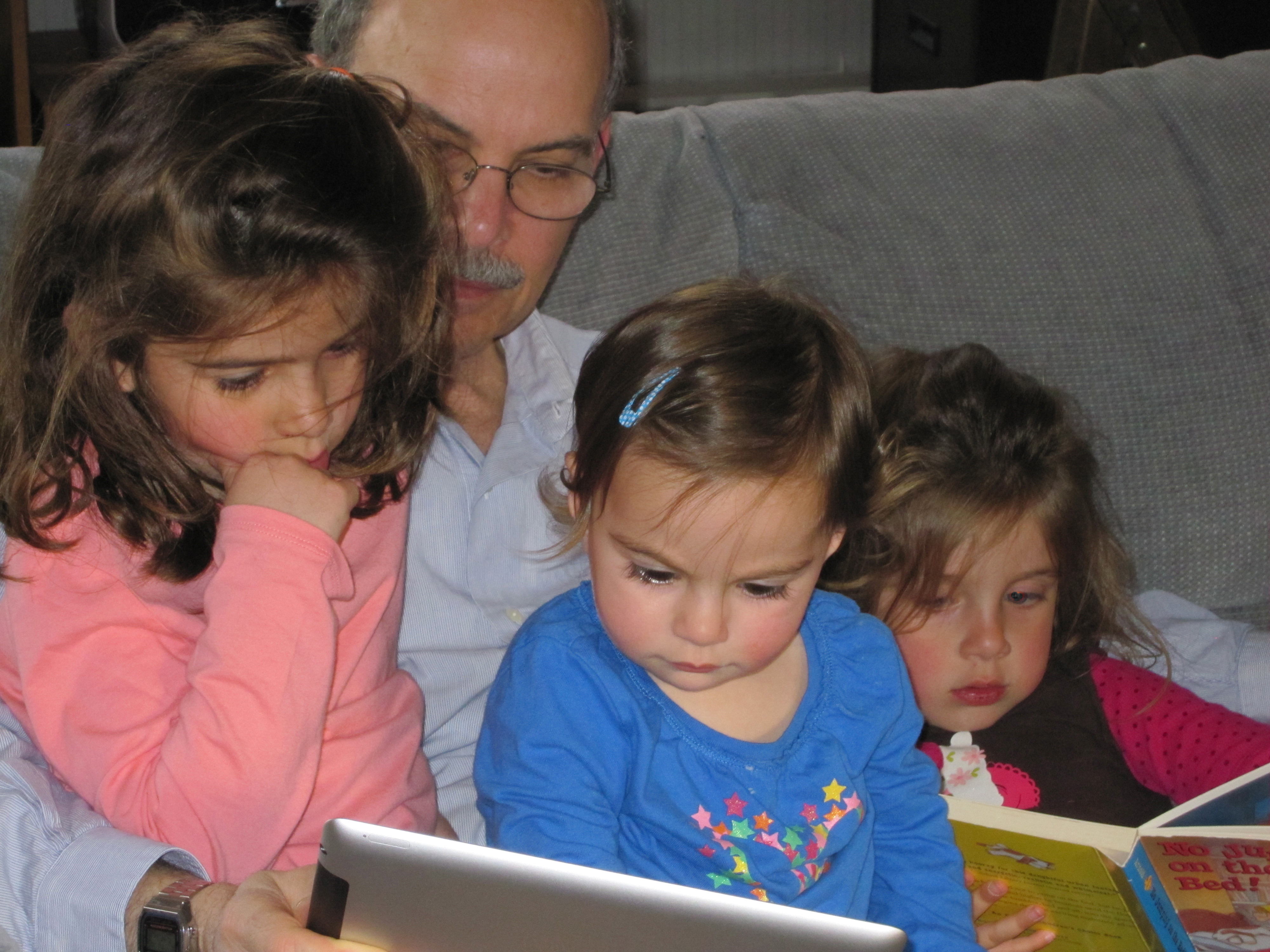 Loew reading with his grandchildren.