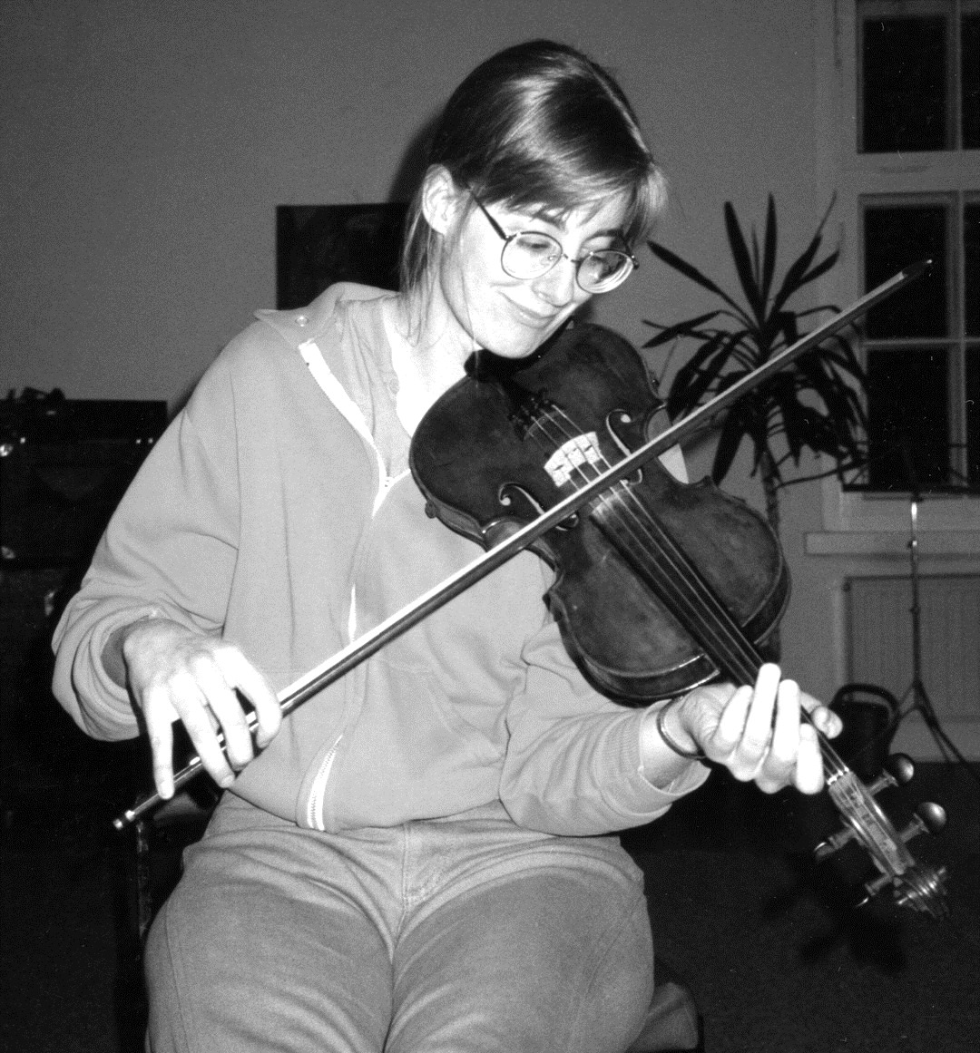 Heidelberger playing the fiddle in Germany during her days as a postdoc.