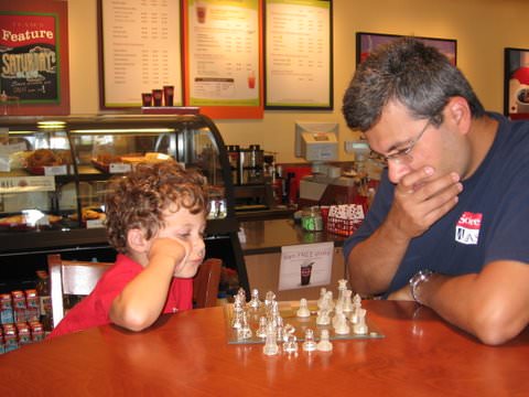 Taner Sen playing chess with his son Burak.